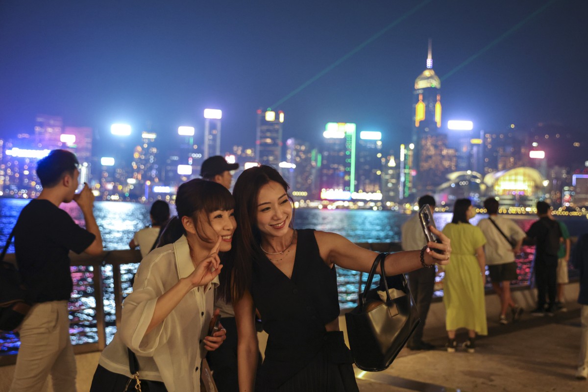 Tourists enjoy the Symphony of Lights at the Avenue of Stars in Tsim Sha Tsui.The Hong Kong government has launched a campaign to boost the city’s nightlife. Photo: Yik Yeung-man