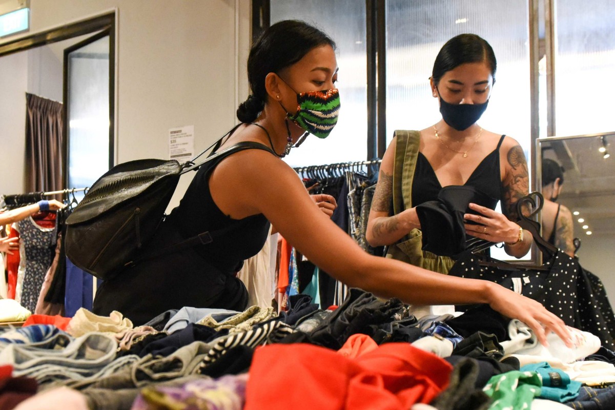 Shoppers browse second-hand clothes in Singapore. Photo: AFP