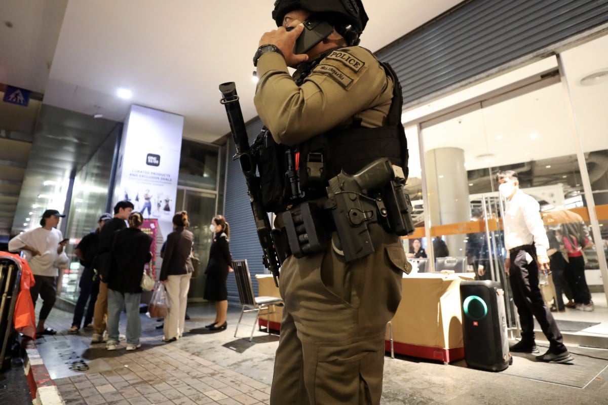 An armed police officer outside the Siam Paragon shopping centre, where the fatal shooting happened on Tuesday. Photo: EPA-EFE