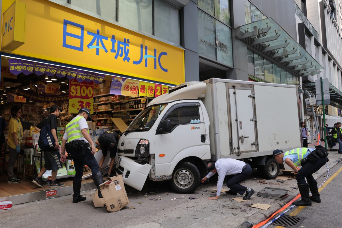 A branch of home goods chain store JHC is hit by one of the trucks in a three-vehicle crash. Photo: Jelly Tse