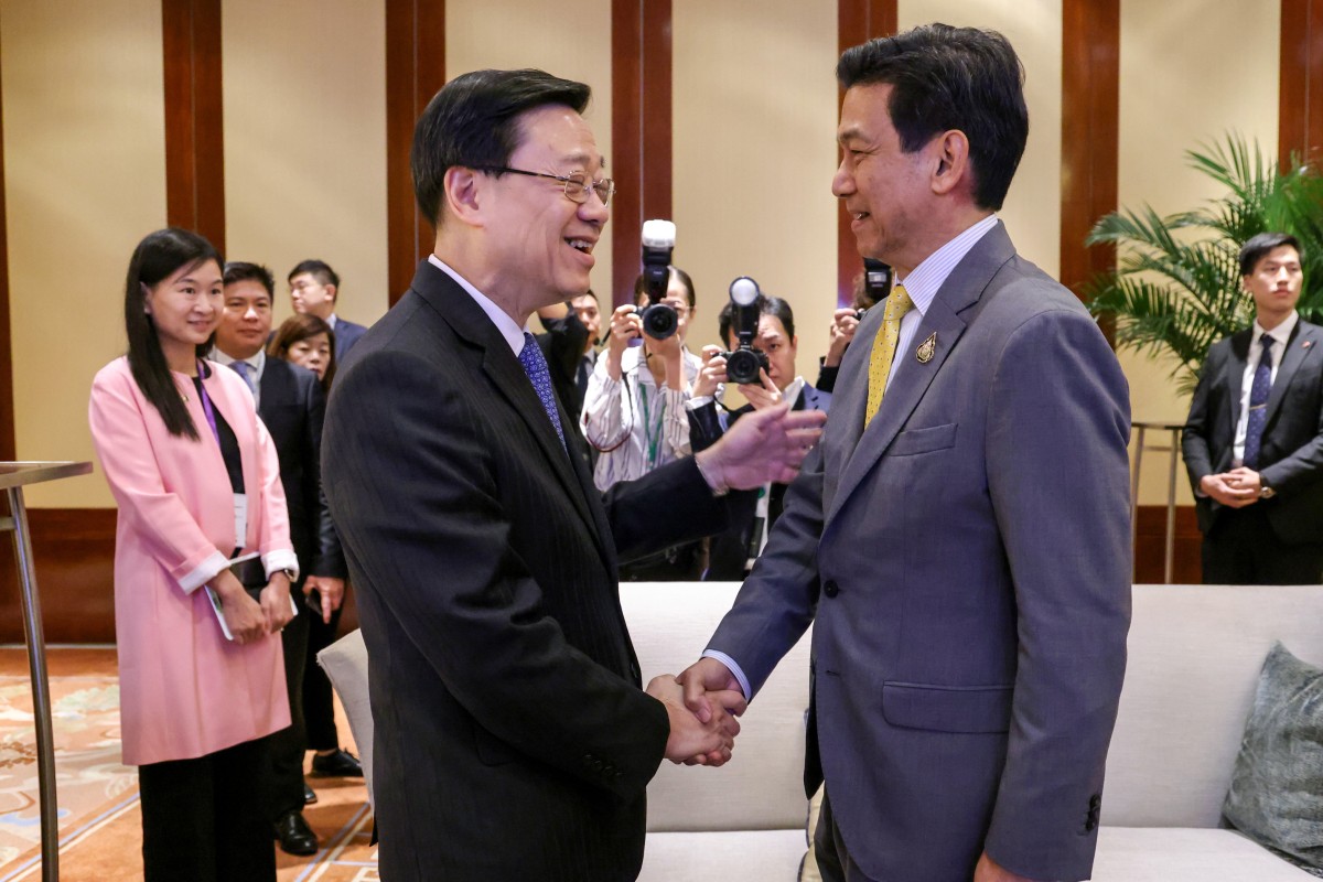 Thai Deputy Prime Minister Parnpree Bahiddha-Nukara (right) shakes hands with Hong Kong Chief Executive John Lee Ka-chiu during the Post’s Hong Kong-Asean Summit 2023 on Monday. Photo: May Tse