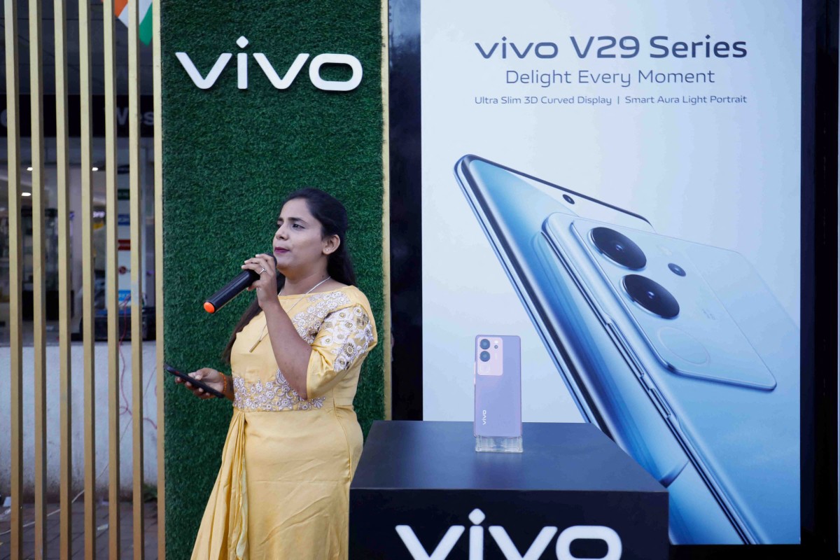A sales representative promotes Vivo smartphones outside a store in Ahmedabad, India, on Tuesday. Photo: Reuters