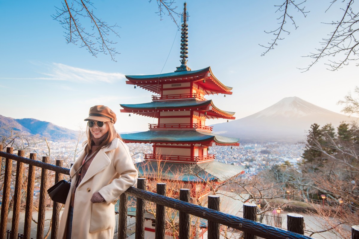 A tourist at the Chureito Pagoda near Japan’s Mount Fuji. New services have been launched and regulations eased to encourage wealthy visitors to the country to go off the beaten track as regions look to recover following the Covid-19 pandemic. Photo: Shutterstock