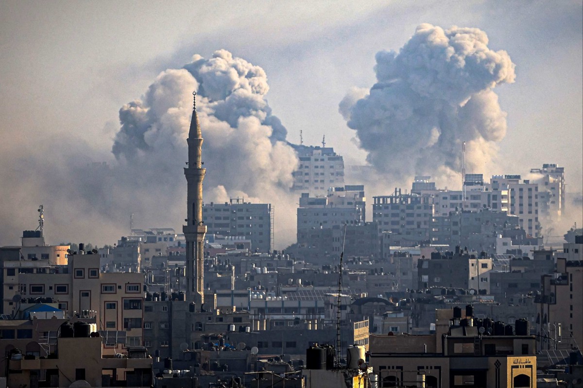 Smoke plumes billow into the air during Israeli air strikes in Gaza City on Thursday. Photo: AFP