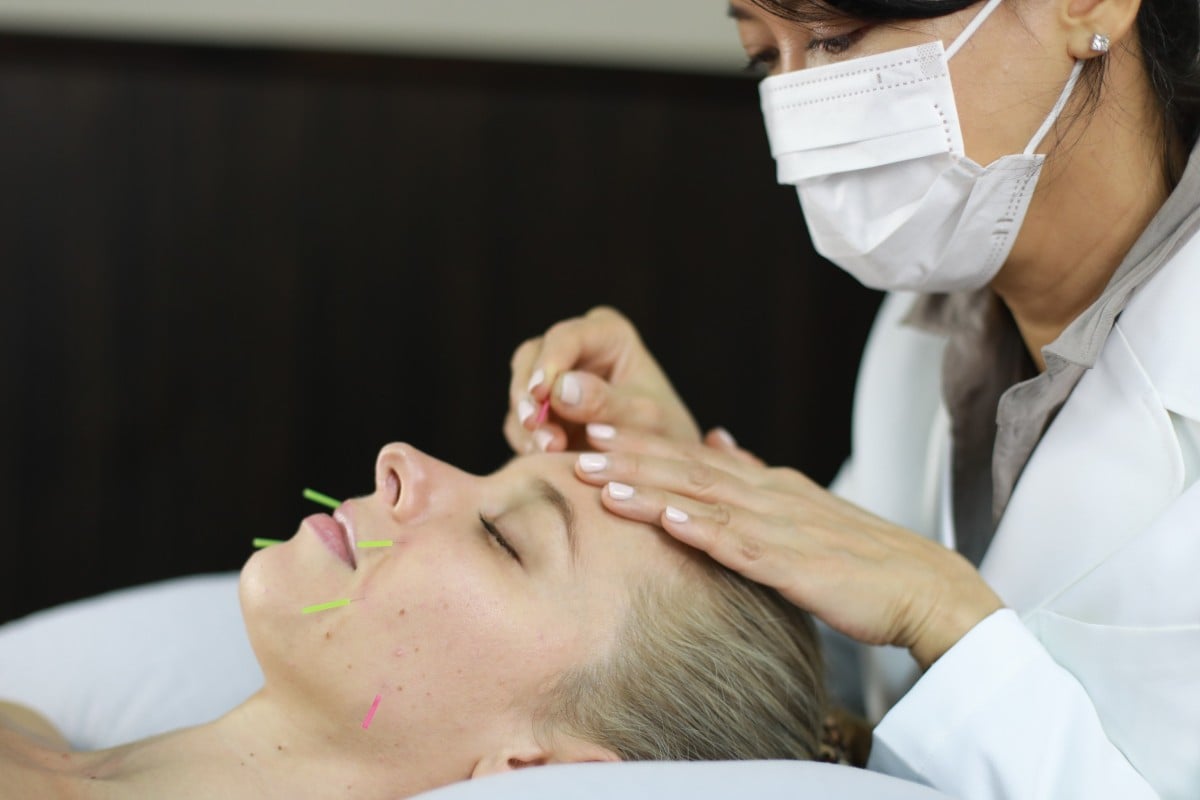 A client undergoes facial acupuncture at Master Ruth traditional Chinese clinic in Central, Hong Kong. Its founder, Ruth Lee, explains its benefits and some of the other treatments her clinic provides.