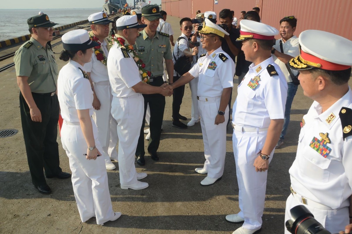 Senior officers from the Myanmar Navy welcome their Chinese counterparts to Myanmar on Monday. Photo: EPA-EFE