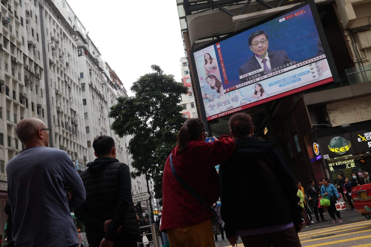 People watch city leader John Lee announce the start of the Article 23 consultation process on Tuesday. Photo: Jelly Tse
