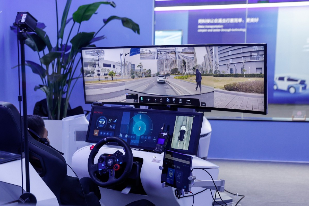 A Baidu employee works on an AI-powered driverless taxi simulator at the company’s Apollo Park centre in Beijing on January 30. Artificial intelligence is poised to make many driving jobs and those in other professions obsolete in the near future, increasing the need for governments to make the transition more equitable. Photo: EPA-EFE