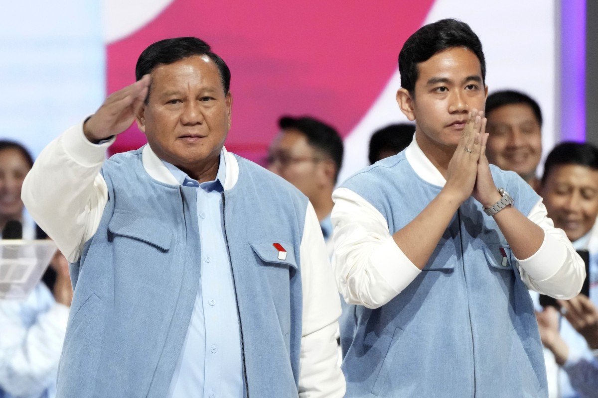 Presidential candidate Prabowo Subianto (left) and his running mate Gibran Rakabuming Raka, the son of Indonesian President Joko Widodo, arrive for the presidential candidates’ debate in Jakarta on February 4. Photo: AP