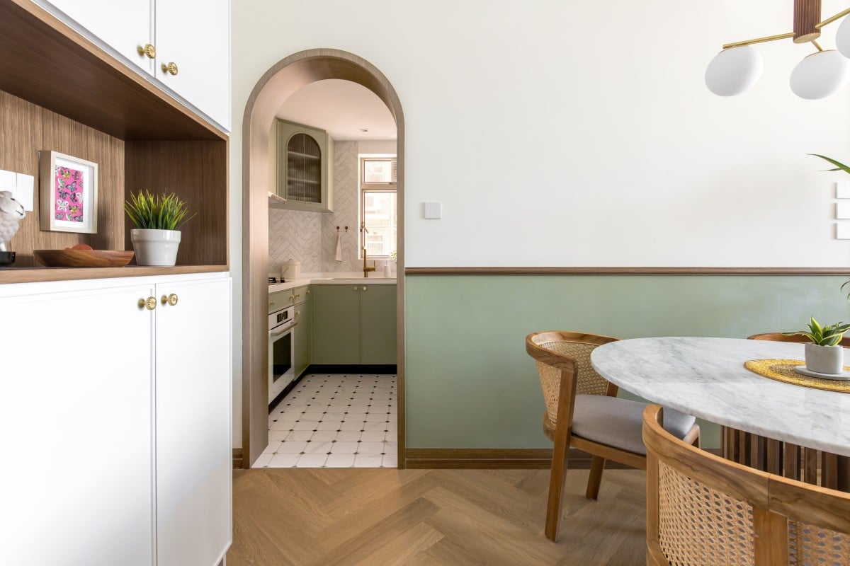 The high-rise apartment in Tsuen Wan, Hong Kong, designed by MT Design makes use of avocado as the primary colour, as seen in the faux wainscot (above) in the dining room, and in the kitchen behind. Photo: Samson Lau