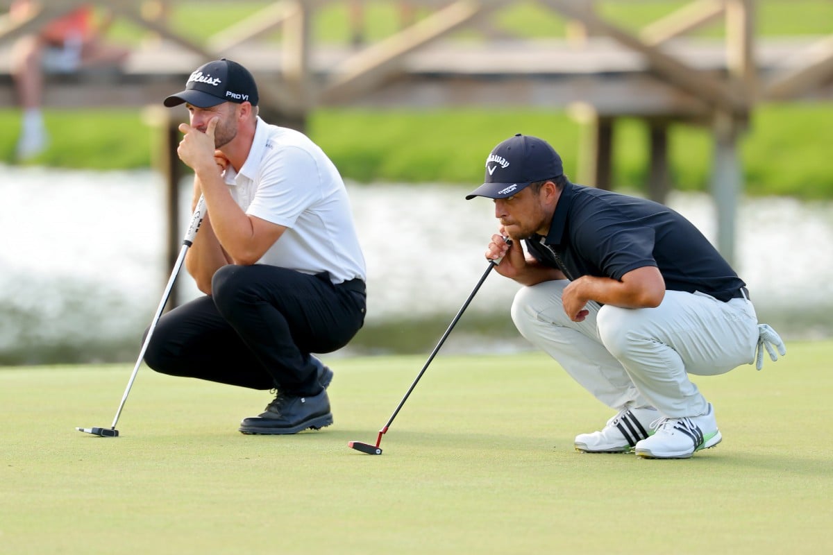 Wyndham Clark (left) and Xander Schauffele study the 12th green during the third round of The Players Championship. Photo: Getty Images