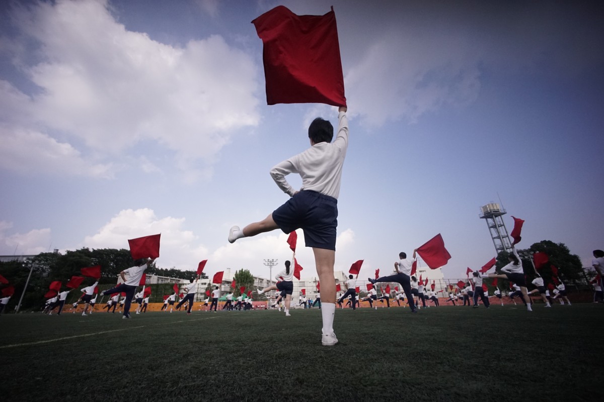 Students practice flag cheering routines at a Korean school in Tokyo. Photo: AP