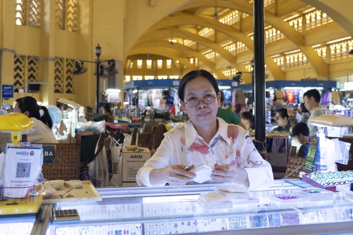 A vendor at Phnom Penh’s Central Market. Built on a filled-in lake bed, the market opened to the public in 1937. Photo: Oliver Raw