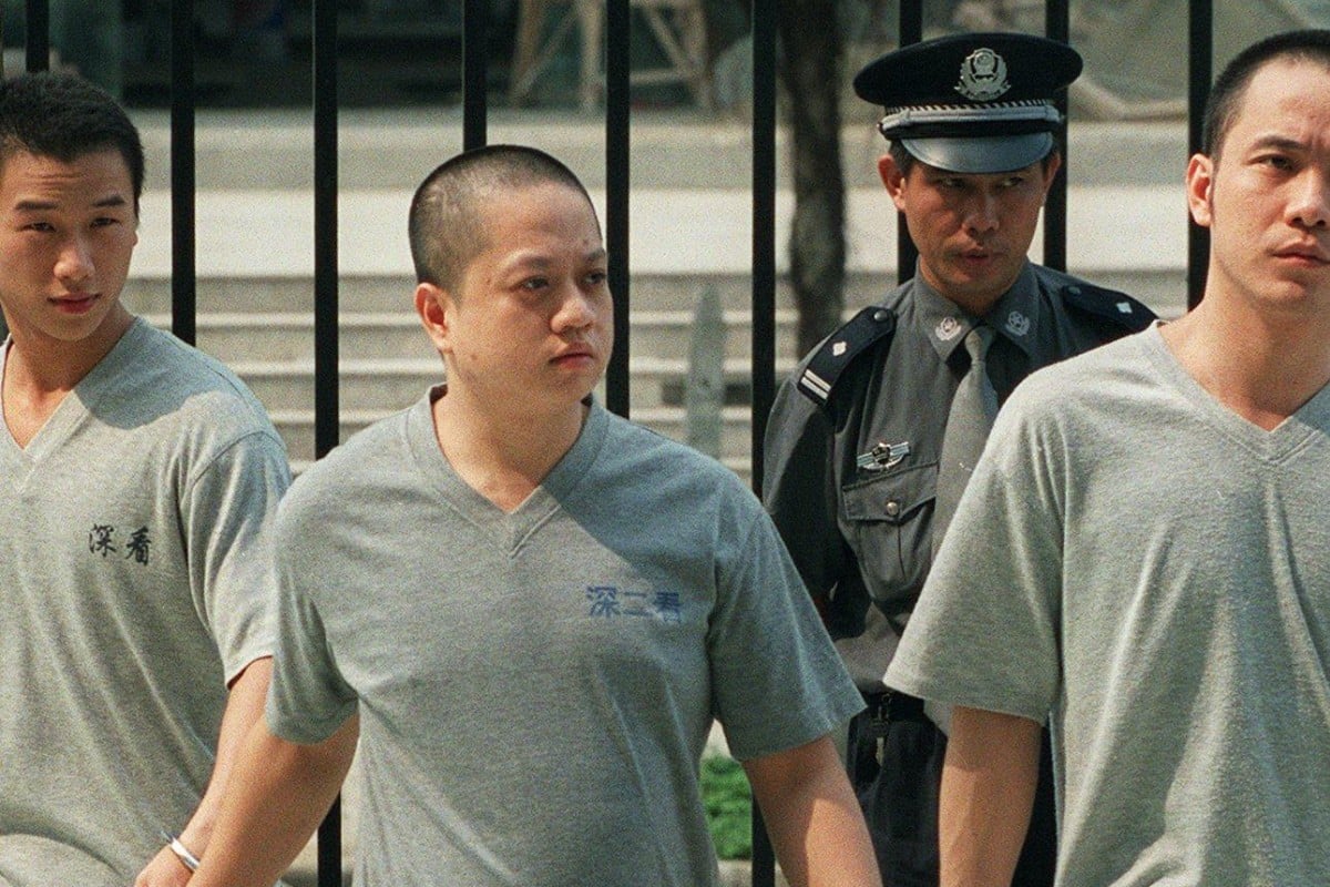 Hong Kong truck driver Tse Kin-man (centre) was tried on weapons smuggling charges at Shenzhen Intermediate Court in Guangdong, China, in 2002. Photo: SCMP
