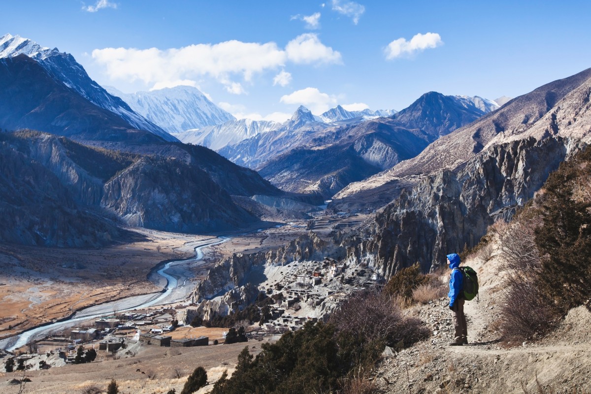 A hiker looks out at mountains on the Annapurna Circuit in Nepal. Photo: Shutterstock