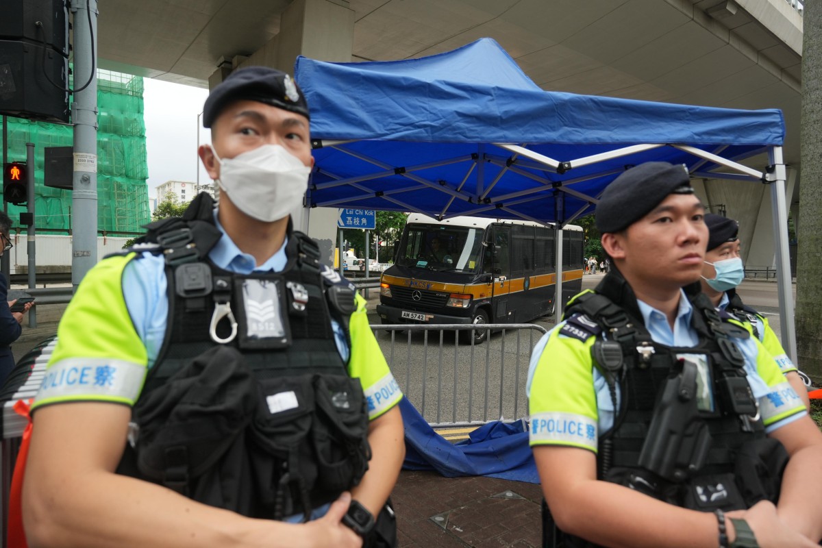 Police on guard outside the court building. Photo: Sam Tsang
