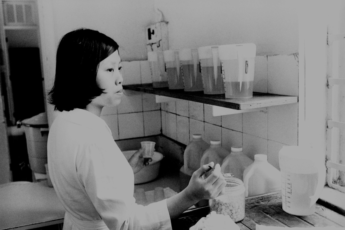 A nurse prepares a dose of methadone for a drug addict at the Violet Peel Clinic. Photo: SCMP