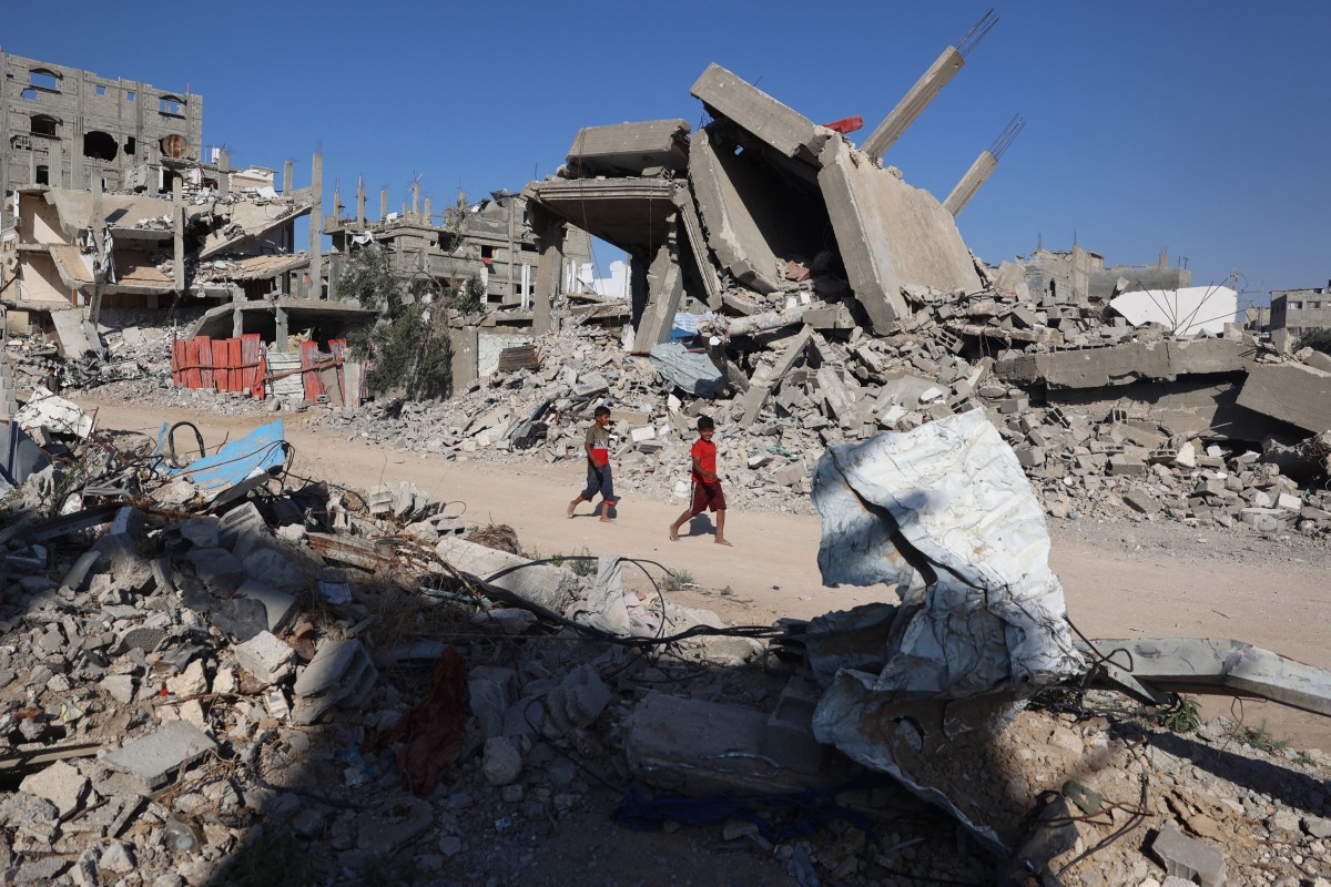 Palestinian boys walk past destroyed buildings in Gaza. Israeli forces have shown a cruel disregard for civilian life there in pursuit of Hamas. Targeting non-combatants is nothing new, as recent Chinese history shows. Photo: AFP