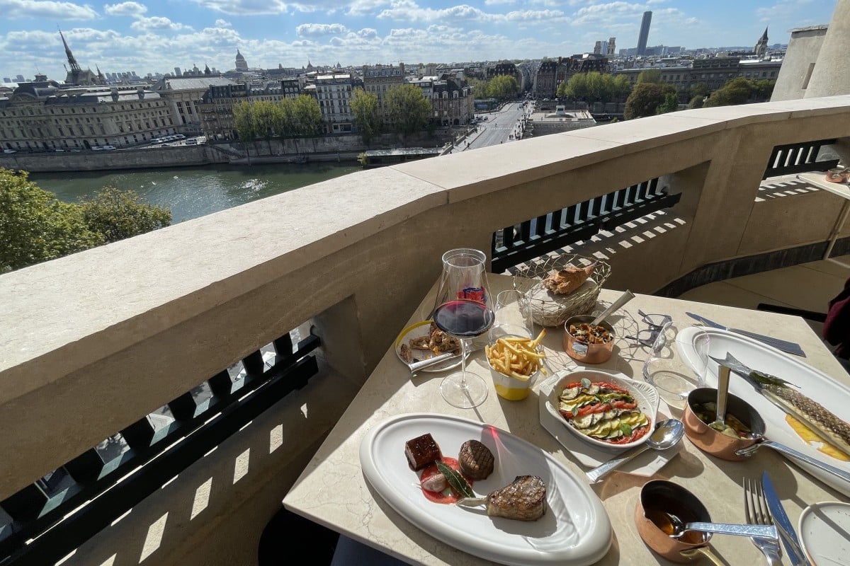 A lunch spread with classic Parisian views over La Conciergerie from the terrace of Le Tout-Paris. Photo: Chris Dwyer
