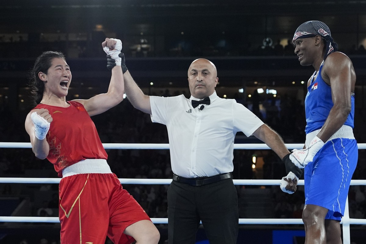 China’s Li Qian celebrates after defeating Panama’s Atheyna Bylon in their women’s 75kg boxing final. Photo: AP