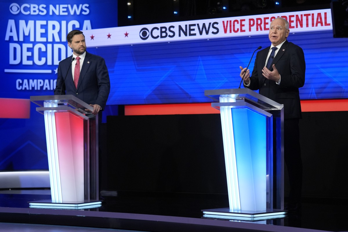 Republican vice-presidential nominee US Senator J.D. Vance (left) and Democratic vice-presidential nominee Minnesota Governor Tim Walz speak on stage at the debate in New York. Photo: AP