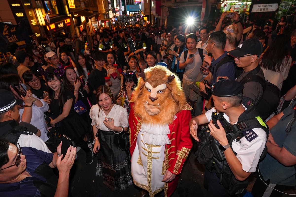 Hongkongers revel in Halloween trickortreating, flash mobs before