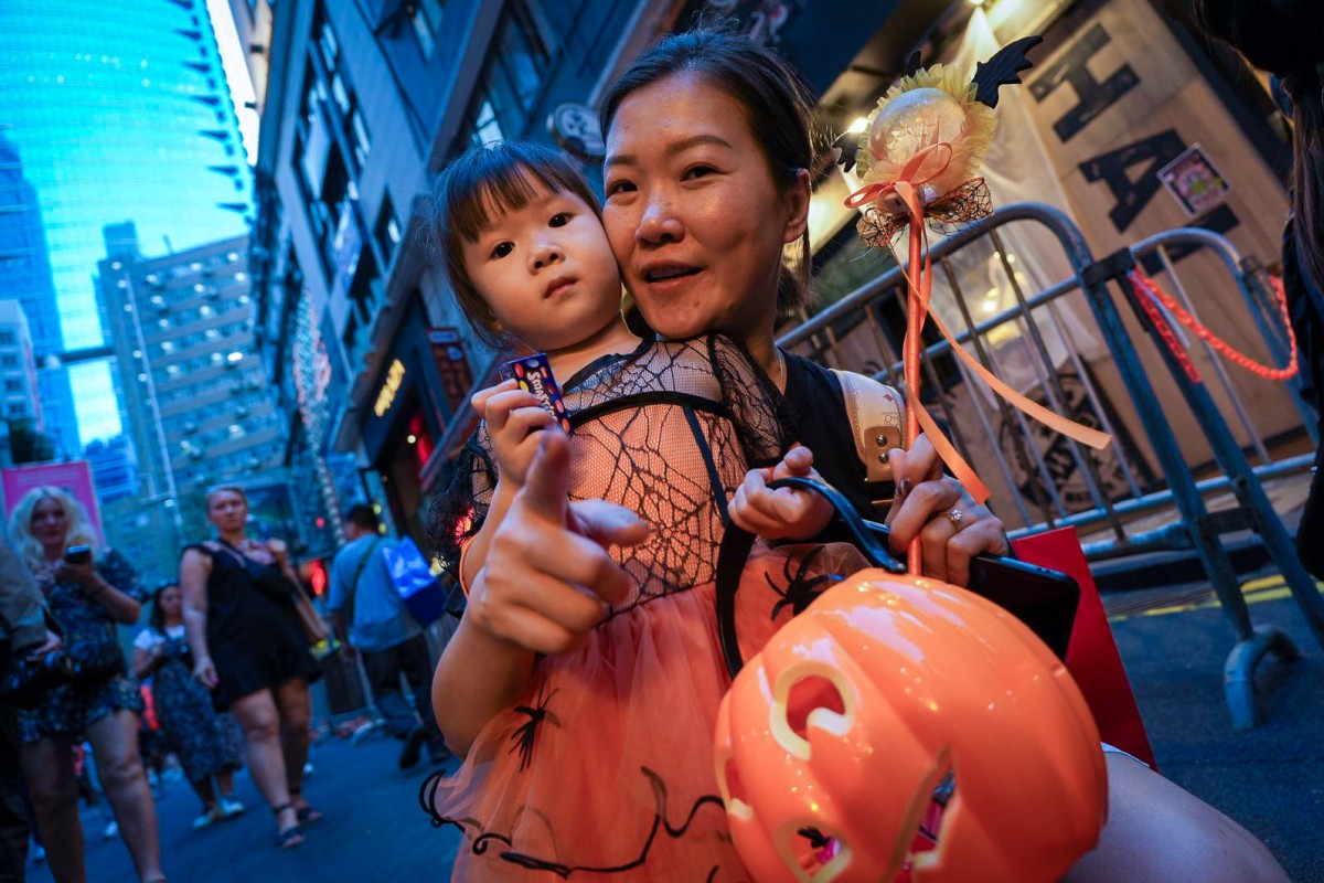 Hongkongers revel in Halloween trickortreating, flash mobs before