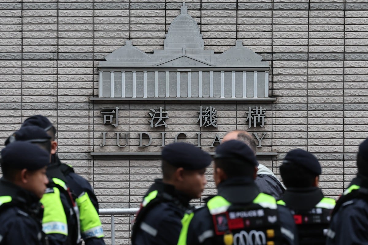Police outside West Kowloon Court as Jimmy Lai’s trial resumes. Photo: Dickson Lee