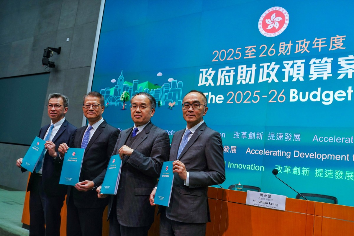 Paul Chan (second from left) with his latest budget blueprint. Photo: Elson Li