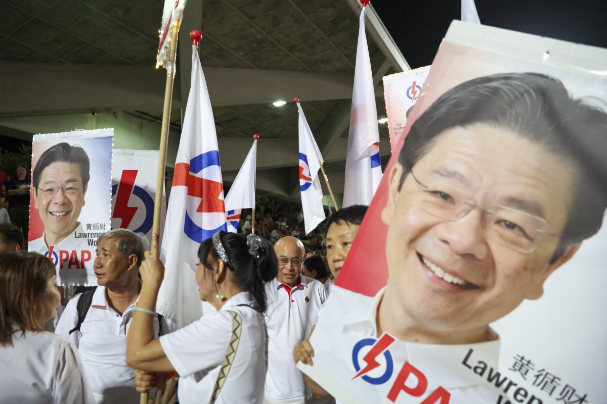 Supporters of Singapore’s Prime Minister Lawrence Wong react while waiting for the vote count on Saturday night. Photo: EPA-EFE