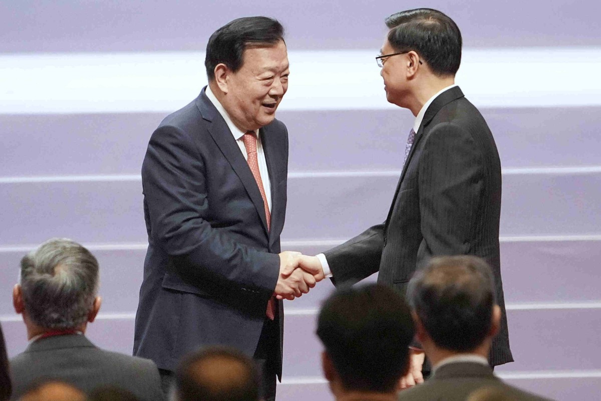 Xia Baolong (left) with city leader John Lee.  Photo: Elson Li