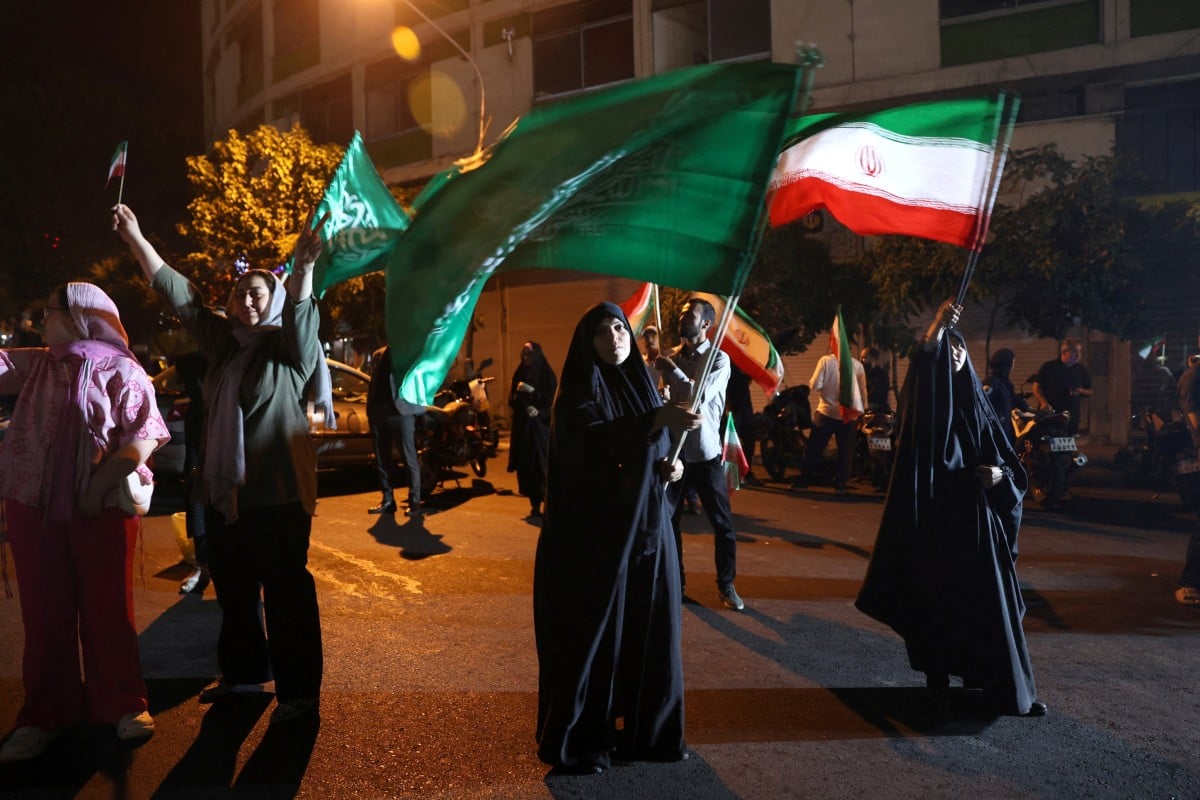 A group of Iranians celebrate in Tehran following the country’s attack on a US military base in Qatar on Monday. Photo: West Asia News Agency via Reuters