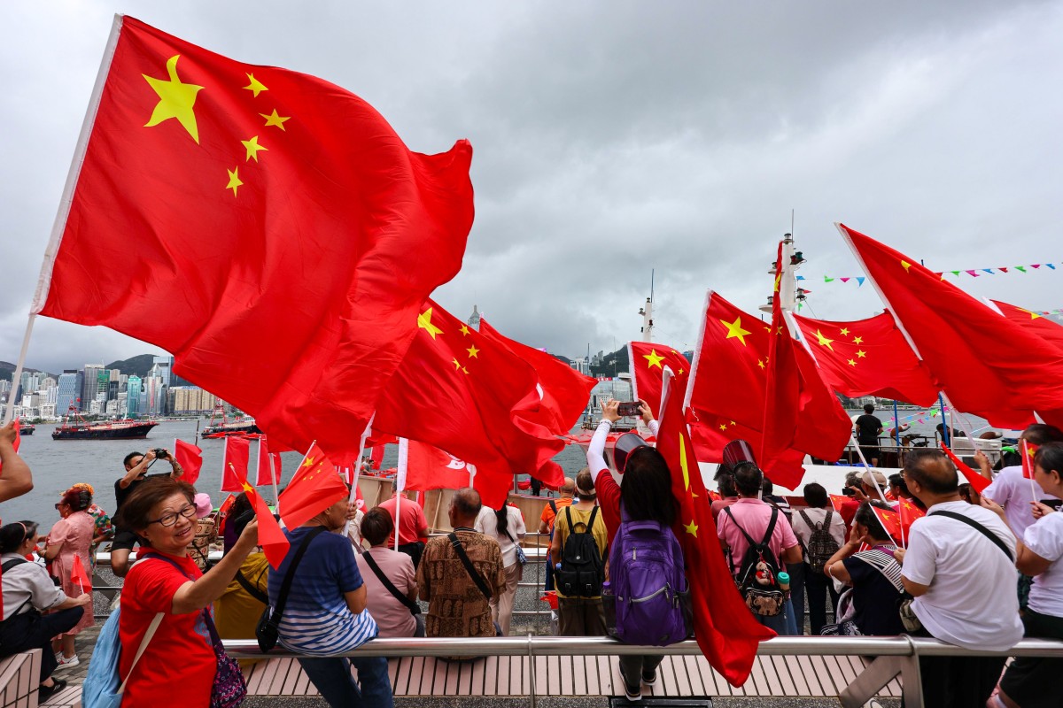 Spectators gather to watch a fishing boat parade to mark the July 1 anniversary. Photo: Jelly Tse
