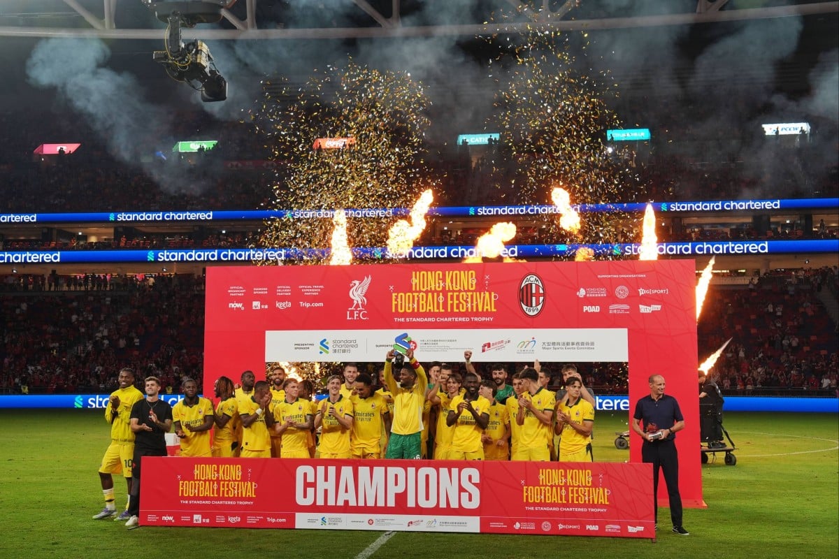 Milan players collect their trophy at Kai Tak Stadium. Photo: Elson Li