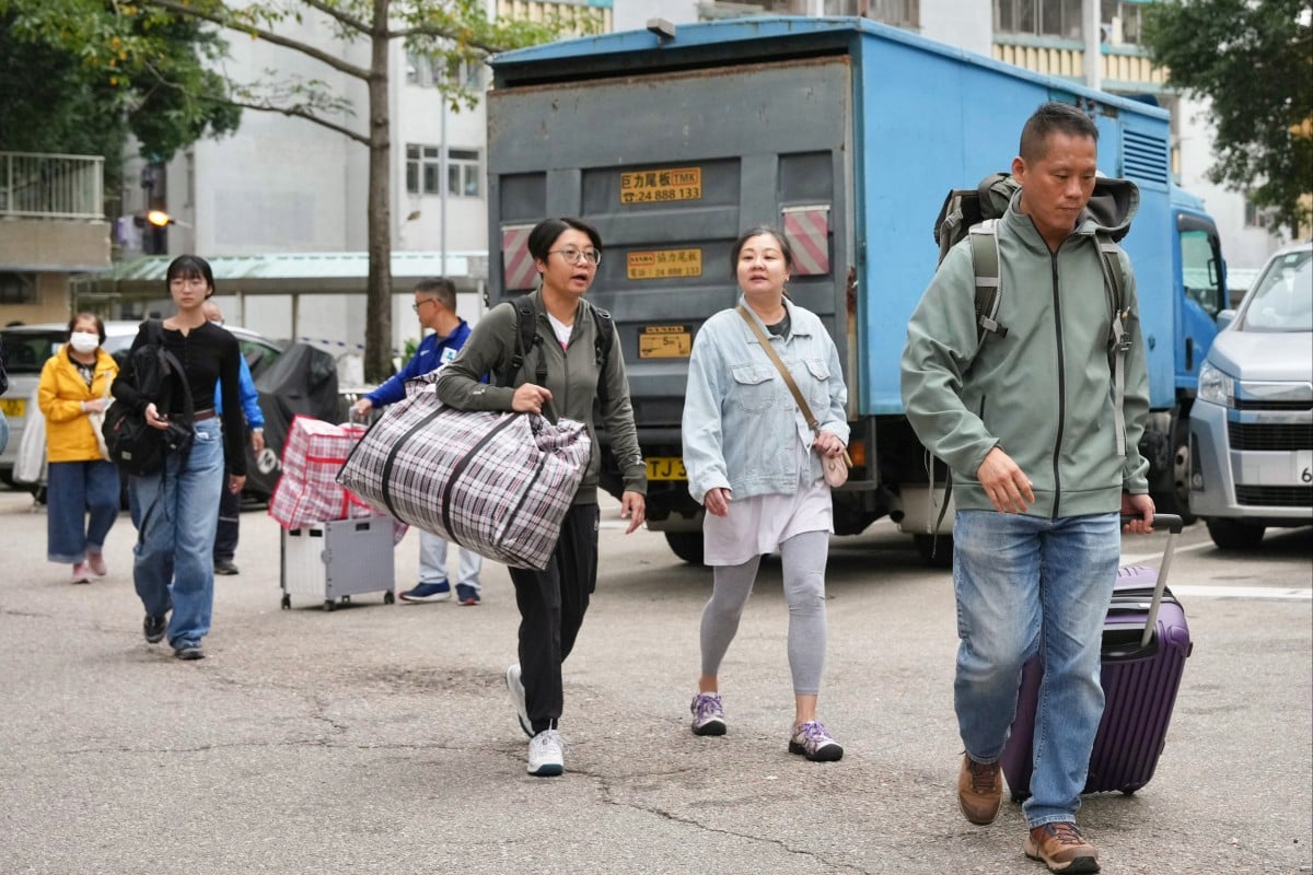 Residents of Wang Chi House returned home to collect some of their belongings. Photo: Karma Lo