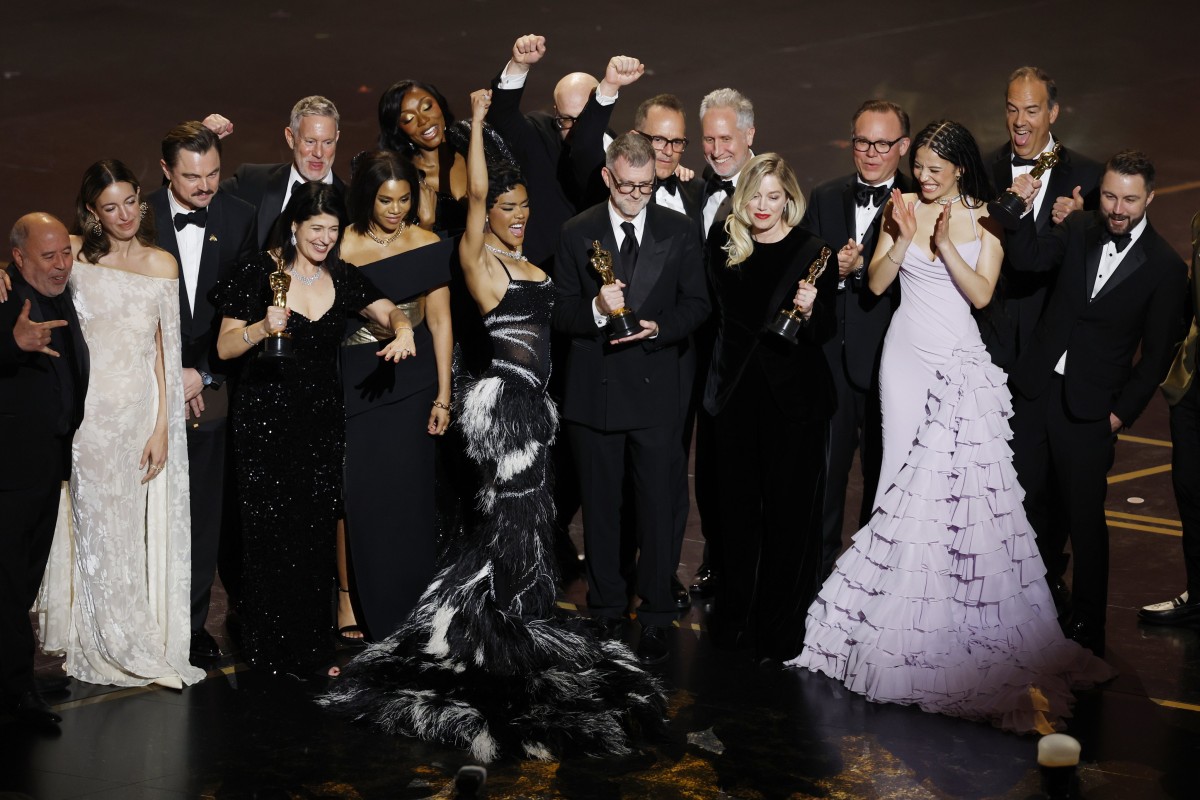 Paul Thomas Anderson (centre) and producer Sara Murphy (centre right) celebrate with the cast and crew onstage after winning the Oscar for best picture for One Battle After Another during the 98th Academy Awards at the Dolby Theatre in Los Angeles on 15 March, 2026. Photo: EPA