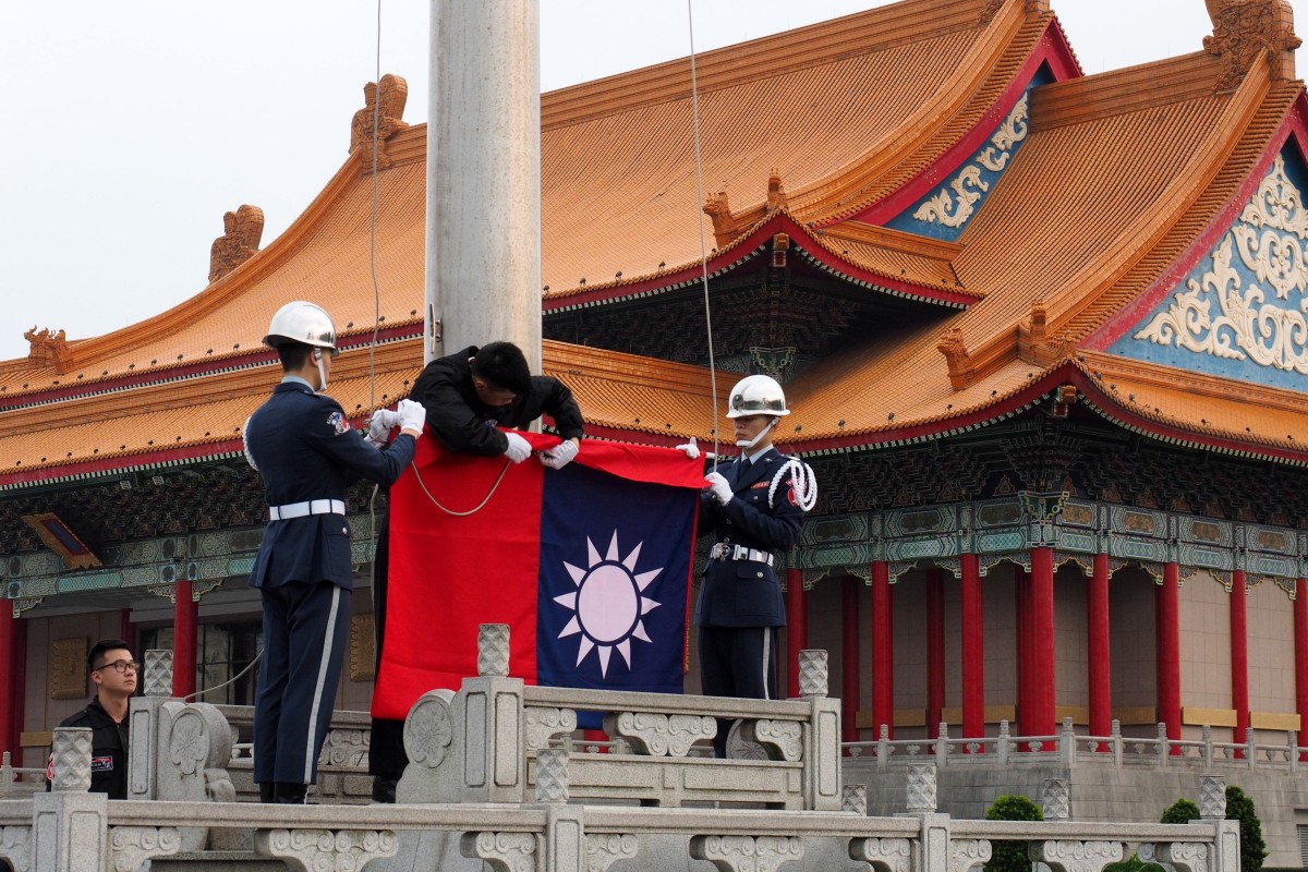 Soldiers hoist Taiwan's national flag at the Liberty Square in Taipei, Taiwan, on Wednesday. Beiijng regards Taiwan as a breakaway province that must be reunited with the mainland. Photo: EPA-EFE