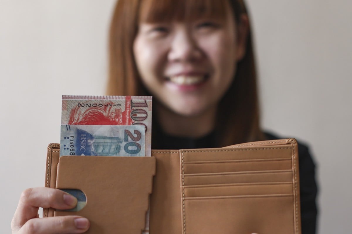 Comma Leung, founder of Mosi Mosi, demonstrates how her wallet, designed for the visually-impaired, functions. Photo: Xiaomei Chen