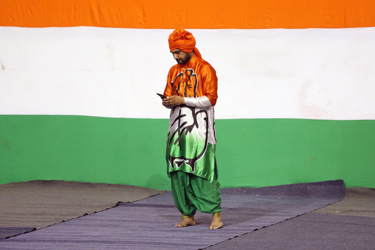 Looking down? A supporter of the Indian National Congress party. Photo: Bloomberg