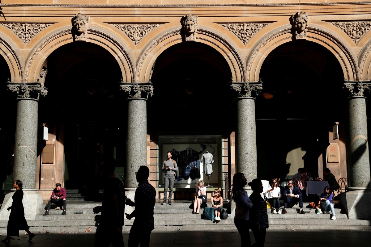 Office workers walk past the General Post Office building during lunchtime in Sydney, Australia. Politically stable, economically resilient and highly transparent, Australia has long been one of the preferred markets for Chinese cross-border property investors. Photo: Reuters