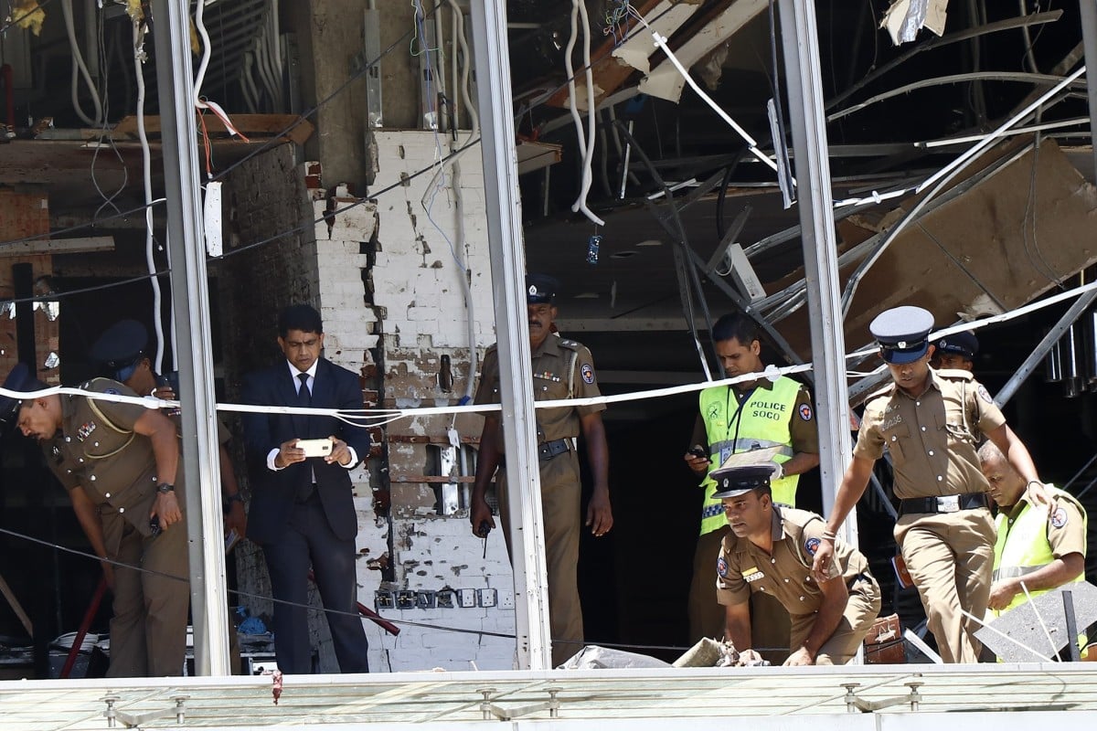 Police and investigators work at the Shangri-La Hotel blast scene in Colombo on Sunday, where the two Chinese were killed. Photo: Xinhua
