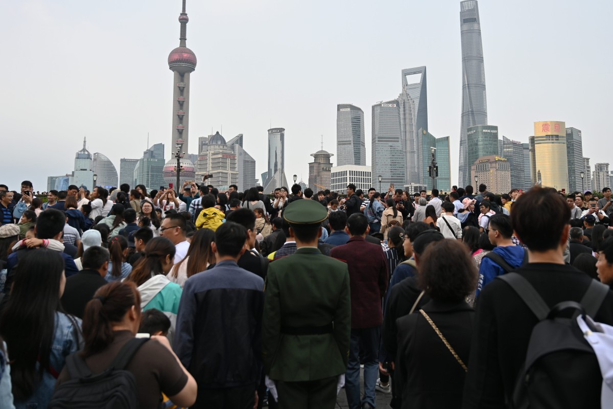 Holiday crowds pack the promenade on the Bund along the Huangpu River in Shanghai on the first day of China’s May break. Photo: AFP