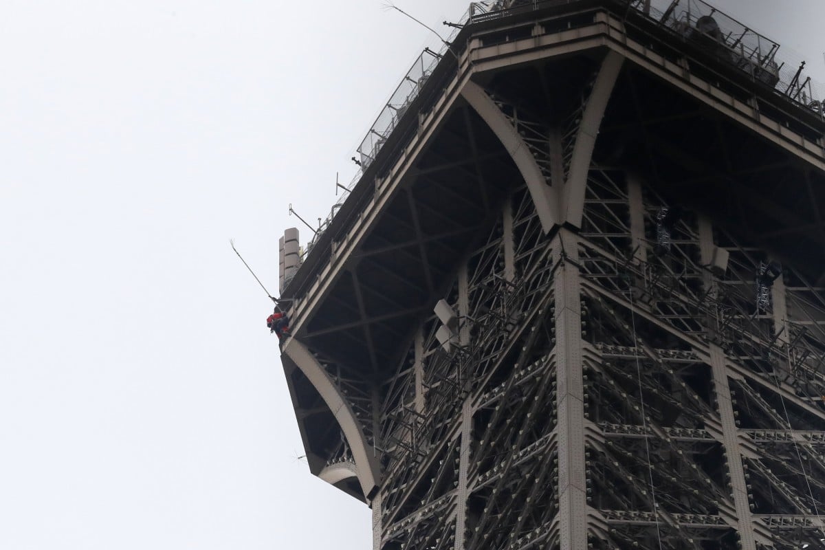 Eiffel Tower evacuated after climber spotted on monument | South China ...