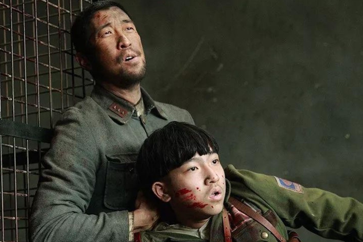 Wang Qianyuan (top) and Zhang Junyi in The Eight Hundred, a film about the Battle of Shanghai which was pulled from the Shanghai International Film Festival.