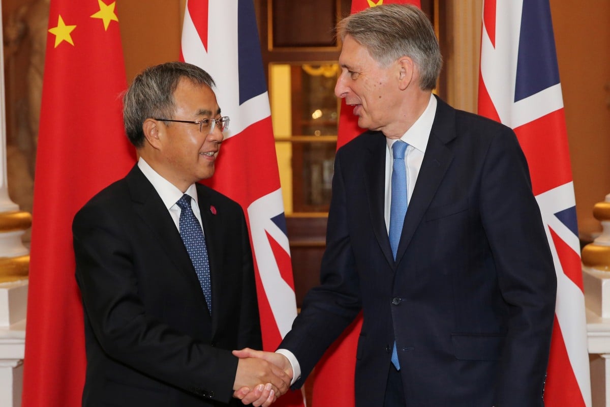 Chinese Vice-Premier Hu Chunhua (left) and British Chancellor Philip Hammond shake hands at London’s Mansion House. Photo: Reuters