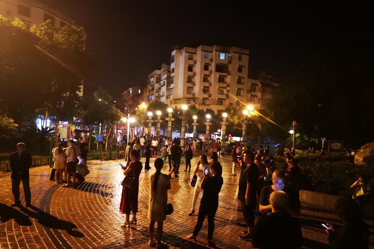 Residents gather in the open in Changning county on Monday night after a magnitude 6.0 hit the area. Photo: Xinhua