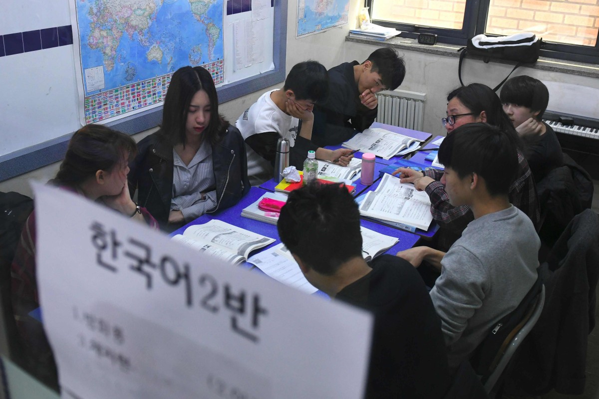 Adult students in a class at Wooridul School in Seoul. Photo: AFP