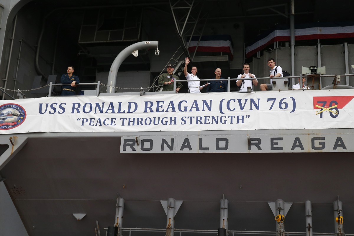 Soft power from the crew of the nuclear-powered aircraft carrier USS Ronald Reagan as it arrives in the Philippines for a port call. Photo: AP