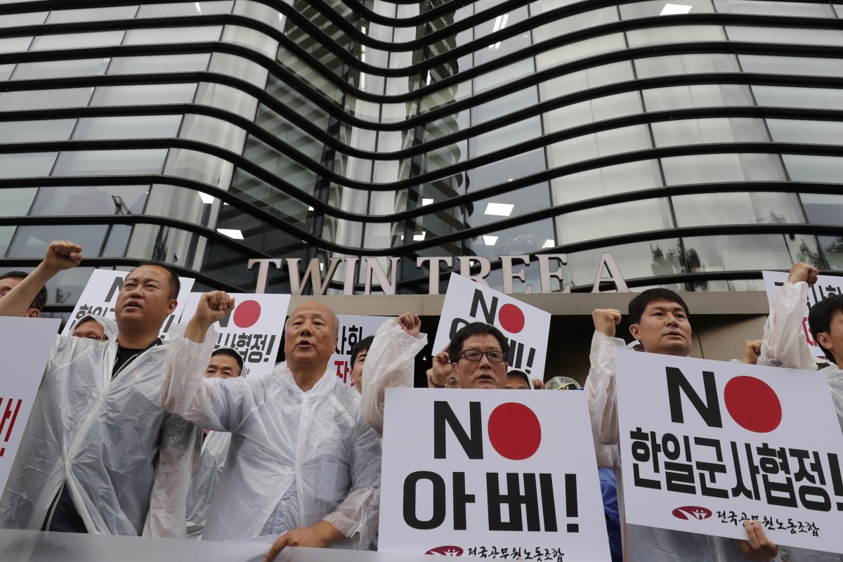 South Korean protesters hold signs saying “No Abe” during a rally demanding the abolition of the General Security of Military Information Agreement. Photo: AP