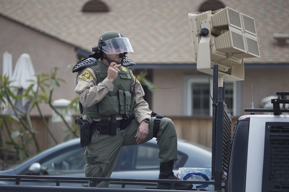 A Los Angeles police officer stands by a sound cannon at a demonstration in Anaheim â Chinese scientists say they have taken the technology to a new level. Photo: AFP